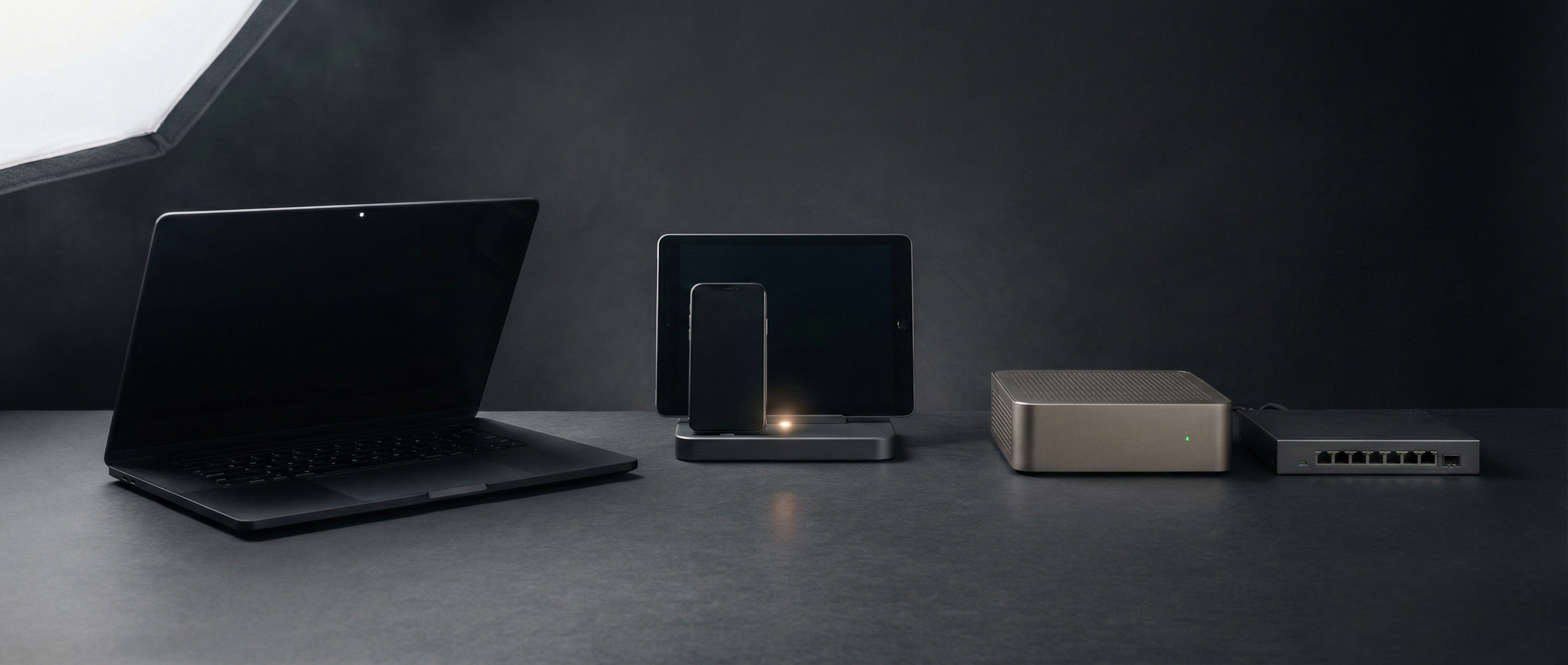 A desktop setup showing a laptop, phone, tablet, and gateway hardware representing local, connected, and managed modes